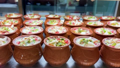 Authentic Indian Rabdi Dessert In Clay Cups Topped With Nuts And Saffron Stock Footage 340957313