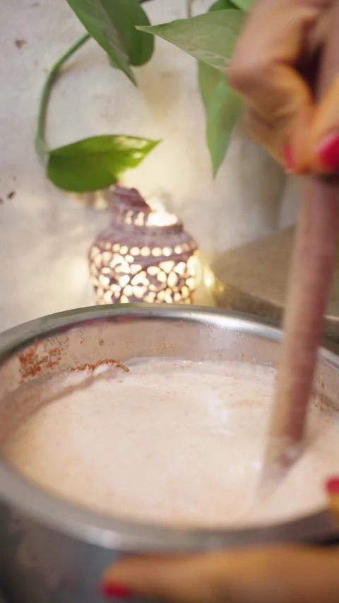 Authentic Indian traditionl curd or yogurt making with bilona. Stock Footage 283362188