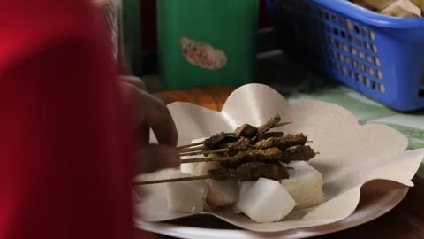 Authentic Indonesian Sate Paru (Beef Lung Satay) with Lontong Rice Cakes Stock Footage 337441128