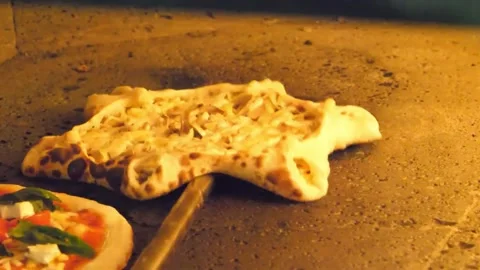 Authentic Italian Star-Shaped Pizza Baking in Traditional Stone Wood-Fired Oven Stock Footage 337678932