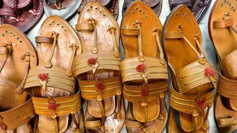 Authentic Kolhapuri chappals displayed in vibrant rows, Stock Photos
