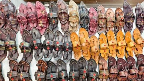Authentic Kolhapuri chappals displayed in vibrant rows, Stock Photos