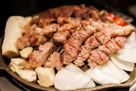 Authentic Korean BBQ Meat on Grill, Restaurant Food Scene Stock Photos