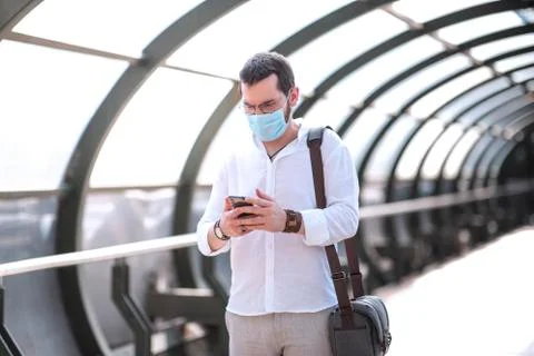 An authentic looking Turkish young man is walking over an isolated footbridge Fotos Stock