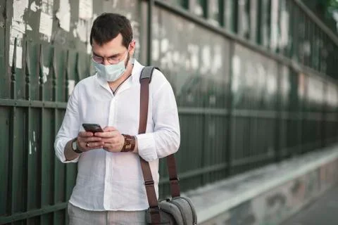 An authentic looking Turkish young man student with protective mask, in an is Foto stock