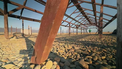 Authentic Male Runner Sprinting Towards Camera Past Foreground Beam Inside .. 스톡 동영상 330857155