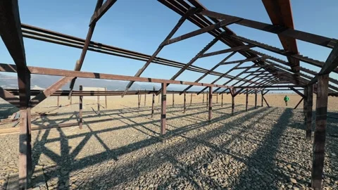 Authentic Man Approaching And Passing Camera Through Abandoned Wooden Frame.. 스톡 동영상 330857313