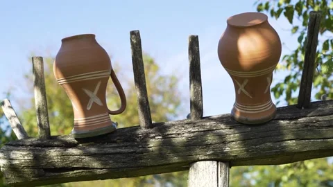 Authentic milk jug dries in the garden in a rural environment. Stock Footage 140938876