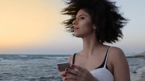 Authentic model with afro hairstyle at the beach Stock Footage 73267090