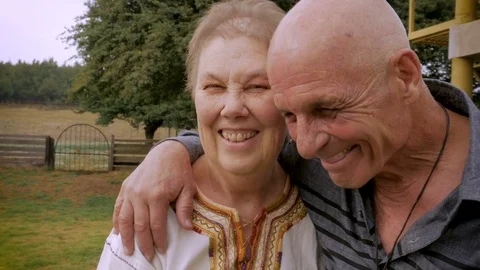 Authentic moment between a senior couple laughing and smiling Stock Footage 81094389