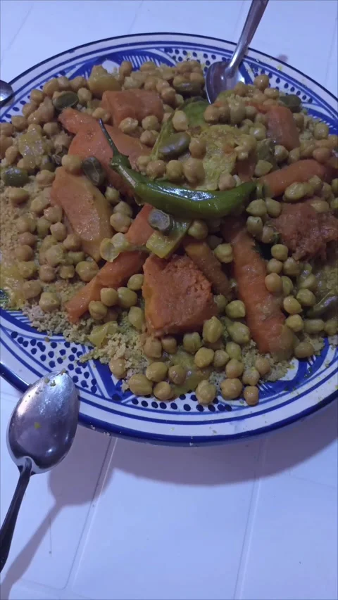 Authentic Moroccan Couscous Dish with Vegetables on Ceramic Plate Stock Footage 334953342