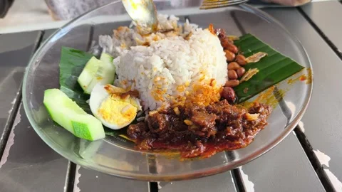 Authentic Nasi Lemak with Fried Egg and Sambal Video stock 329099006