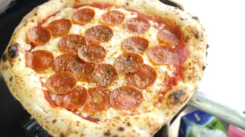 Authentic Neapolitan Pepperoni Pizza with Leopard Spotted Crust Stock Footage 337676758