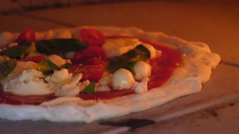 Authentic Neapolitan Pizza Baking in Traditional Wood-Fired Stone Oven Video stock 337676611