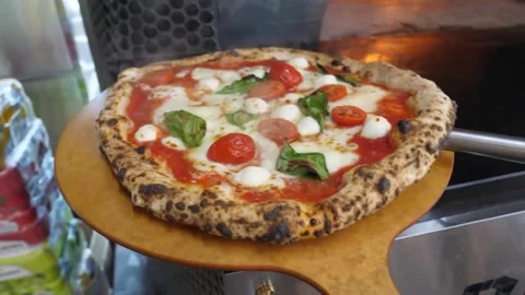 Authentic Neapolitan Pizza Margherita Baking in Traditional Wood-Fired Stone Ove Stock Footage 337676647