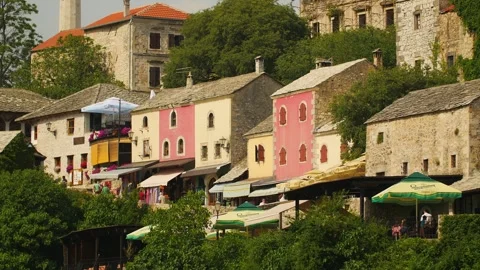 Authentic old colored stone houses in Mostar in the tourist street, Bosnia Stock Footage 241657613