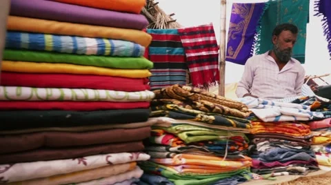 Authentic old man villagers Man selling cloths in village market Stock Footage 55717051