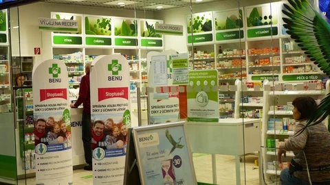 Authentic operation pharmacy interior customers pharmaceuticals medicines shop Stock Footage 118839192