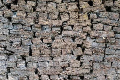 Authentic peat blocks as old-fashioned fossil fuel. Stock Photos