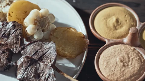 Authentic Peruvian Anticuchos with Corn, Potatoes, and Dipping Sauces Stock Footage 339077860