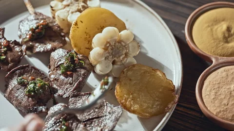 Authentic Peruvian Anticuchos Grilled Beef Heart Skewers with Corn and Potatoes Stock Footage 338340820