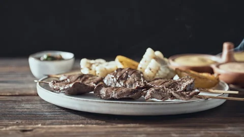 Authentic Peruvian Anticuchos Grilled Beef Heart Skewers with Corn and Potatoes Stock Footage 339077866