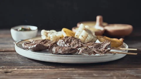 Authentic Peruvian Anticuchos Grilled Beef Heart Skewers with Corn and Potatoes Video stock 341436801