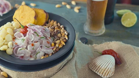 Authentic Peruvian Ceviche with Fried Seafood and a Glass of Cold Beer Stock Footage 338341172