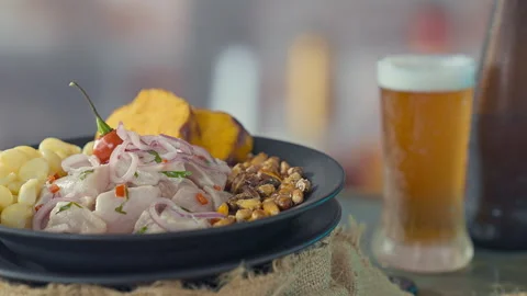 Authentic Peruvian Ceviche with Fried Seafood and a Glass of Cold Beer Stock Footage 338341173