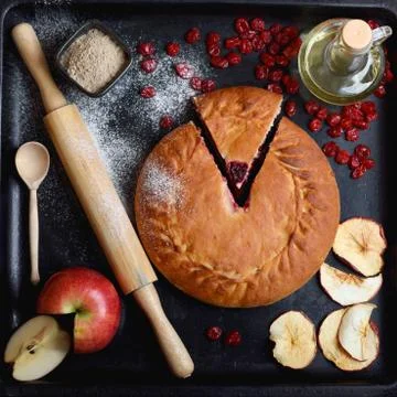 Authentic pie on a black background with ingredients Stock-Fotos