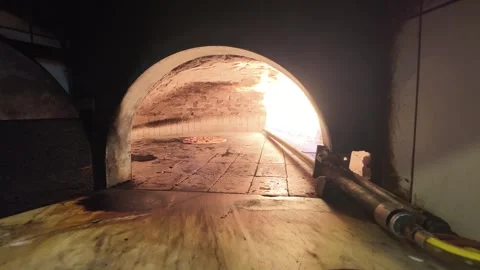 Authentic Pizza Baking in Traditional Stone Oven with Flames Stock Footage 332486582