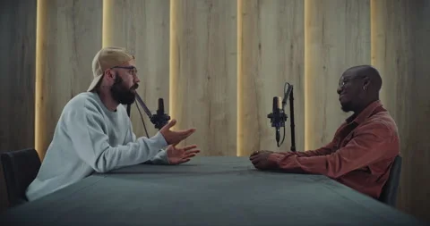Authentic Podcast Talk Between Two Men in Professional Studio Setup Stock Footage 322099675