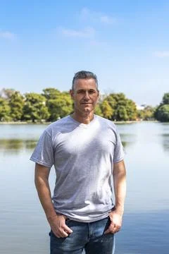 Authentic portrait of an attractive middle aged man outdoors Stock Photos