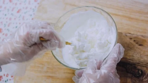 Authentic precise culinary: folding seasonings through cream cheese Stock Footage 342184348