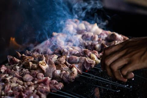 Authentic Process of Making Sate Klatak, Chef Hands Skewering Raw Mutton on.. Stock Photos