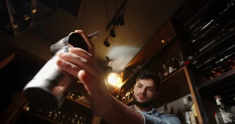 Authentic professional caucasian bartender creating a cocktail drink Stock-Footage 132733186