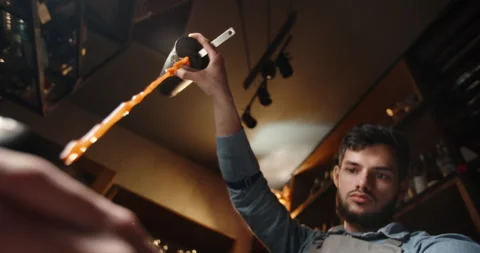 Authentic professional caucasian bartender creating a cocktail drink 動画素材 133128485