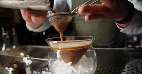 Authentic professional caucasian bartender creating a cocktail drink Stock-Footage 133254160