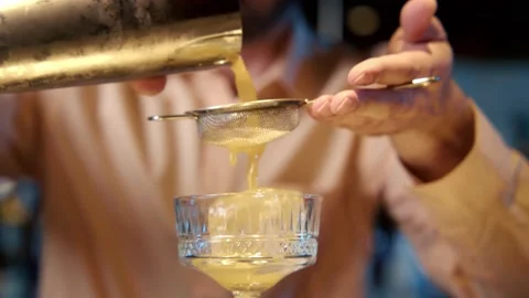 Authentic professional caucasian bartender creating a cocktail drink. Video stock 239101451
