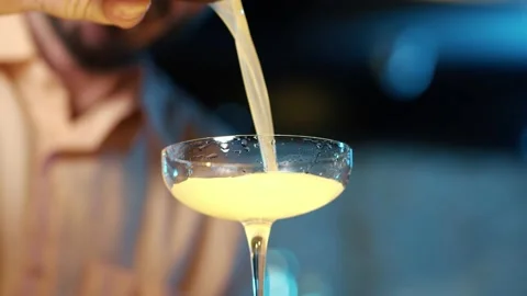 Authentic professional caucasian bartender creating a cocktail drink. Video stock 239101792