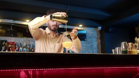 Authentic professional caucasian bartender creating a cocktail drink. Stock Footage 239103143