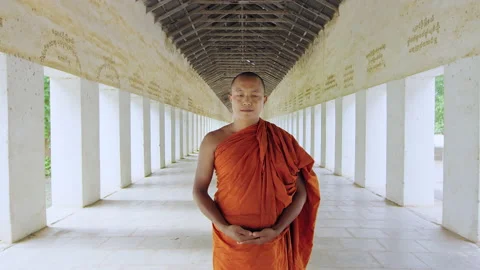 Authentic real monk walking in ancient passage way of temple Bagan Myanmar / Bur Stock Footage 201095493