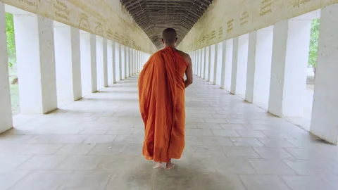 Authentic real monk walking in ancient passage way of temple Bagan Myanmar / Bur Stock Footage 201097126