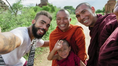 Authentic real monks and African American man tourist traveler in Bagan Mayanmar Video stock 201096141