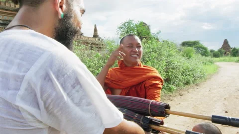 Authentic real monks In Bagan Mayanmar / Burma receiving an offering or gift of Stock Footage 201093945