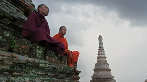 Authentic real monks In Bagan Mayanmar / Burma doing meditation on roof of  anci Stock Footage 201094382