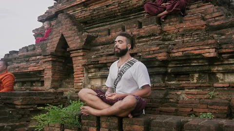 Authentic real monks In Bagan Mayanmar / Burma doing meditation on ancient pagod Stock Footage 201094427
