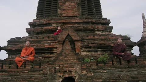 Authentic real monks In Bagan Mayanmar / Burma doing meditation on ancient pagod Stock Footage 201095042