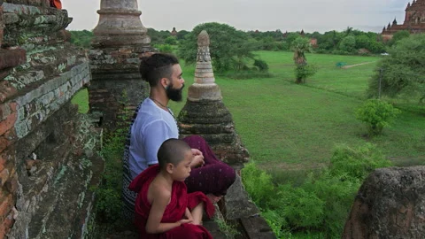 Authentic real monks In Bagan Mayanmar / Burma doing meditation on roof of  anci Видео 201095249