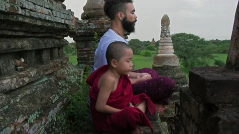 Authentic real monks In Bagan Mayanmar / Burma doing meditation on roof of  anci Видео 201096266